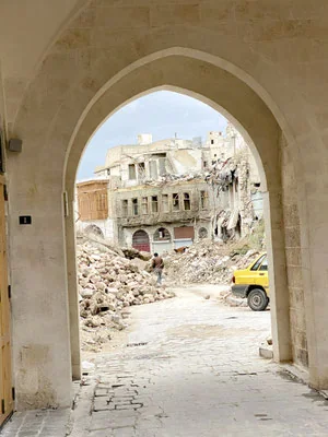 Aleppo seen through an arch after destruction